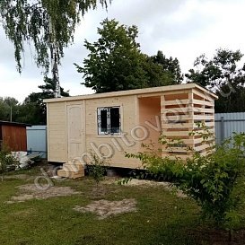 Деревянная бытовка  с дровником фото