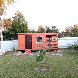 Бытовка с металлической дверью и дровником фото